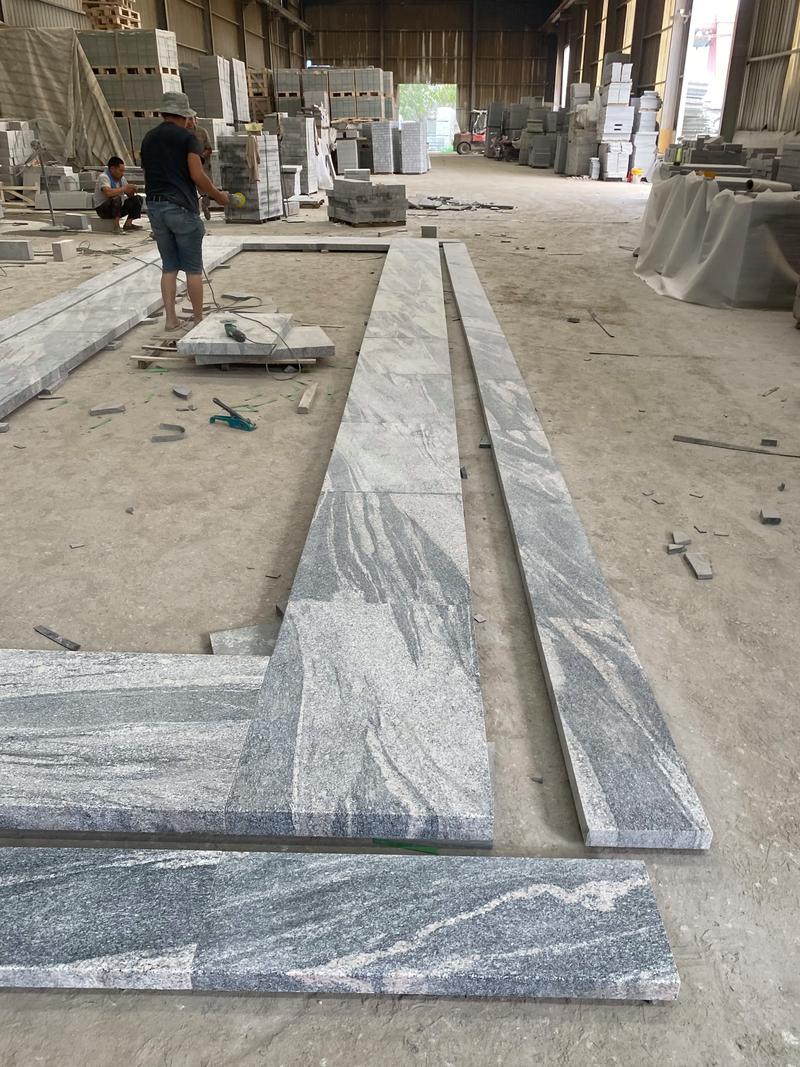 山水岩火烧水洗面石材加工厂.山水岩石材在现代建筑中的应用非常